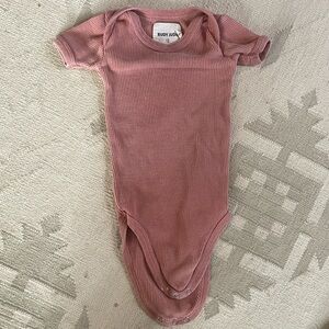 Rudy Jude baby waffle thermal onesie in terracotta.